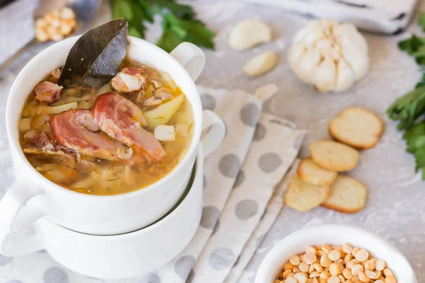 Traditional homemade thick pea soup with smoked meat in a white plate for a family dinner — Stock Image Traditional Homemade Thick Pea Soup Smoked Meat White Plate Family Stock Image