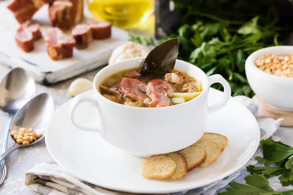 Traditional homemade thick pea soup with smoked meat in a white plate for a family dinner — Stock Image Traditional Homemade Thick Pea Soup Smoked Meat White Plate Family Stock Photo