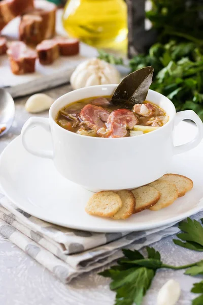 Traditional homemade thick pea soup with smoked meat in a white plate for a family dinner — Stock Image Traditional Homemade Thick Pea Soup Smoked Meat White Plate Family Royalty Free Stock Photos