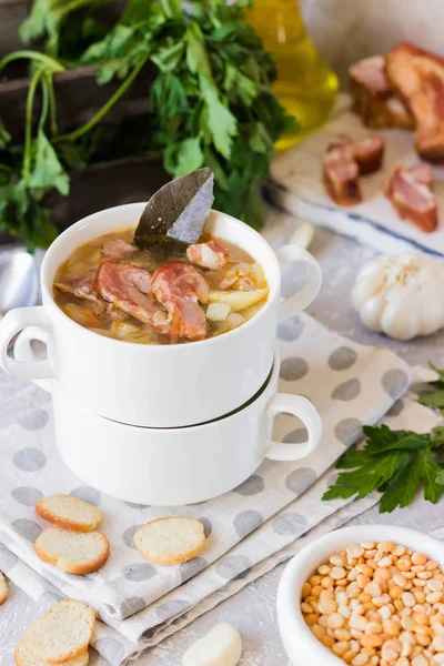 Traditional homemade thick pea soup with smoked meat in a white plate for a family dinner — Stock Image Traditional Homemade Thick Pea Soup Smoked Meat White Plate Family Royalty Free Stock Images