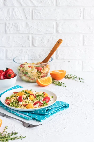 Healthy and simple food, light summer lunch, fragrant salad with couscous and oranges
