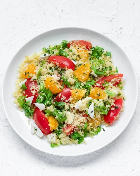 Healthy and simple food, light summer lunch, fragrant salad with couscous and oranges