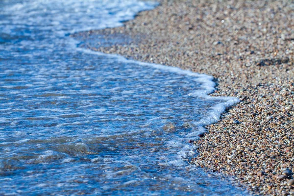 Гранит Цвета Морской Гальки Песчаном Фоне Берег Пляжа Песком Галькой — стоковое фото