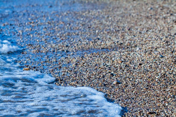 Гранит Цвета Морской Гальки Песчаном Фоне Берег Пляжа Песком Галькой — стоковое фото