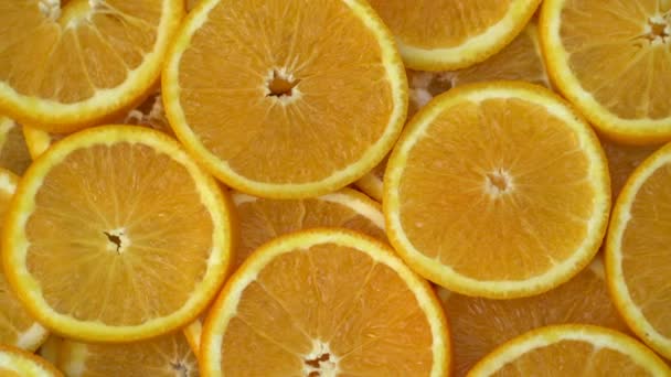 Περιστρέψετε τα φρούτα φρέσκα εσπεριδοειδή πορτοκάλια. Αδιάλειπτη βρόχο νηματοποίηση φέτες πορτοκαλιών. — Αρχείο Βίντεο