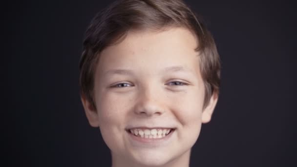 Portrait of boy looking the camera and laughing. — Stock Video