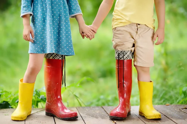 Little Children Wearing Oversized Rubber Boots Holding Hands Brother Sister — Stock Photo, Image