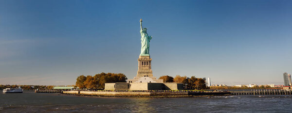 Panorama of island of Liberty with statue of Liberty seen from the ferry in the Hudson river. Symbol of the New york.