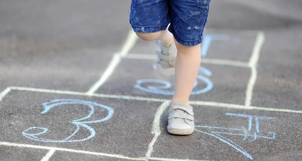 Closeup Little Boy Legs Hopscotch Drawn Asphalt Child Playing Hopscotch — Stock Photo, Image