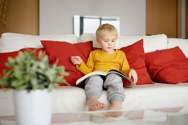 Little Boy Sitting Home Couch Reading Book Learning Read Home — Stock Photo, Image