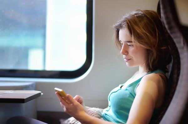 Portrait Beautiful Girl Communicating Phone Train Car Mobile Communication Joy — Stock Photo, Image