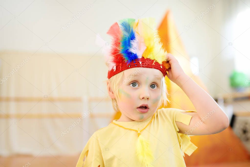 Little boy involved in performance children's theatre Studio in the role of the American Indian.