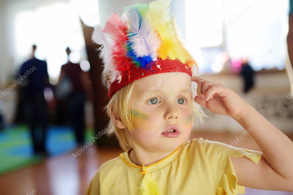 Little boy involved in performance children's theatre Studio in the role of the American Indian.