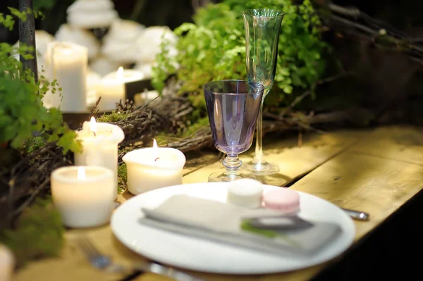 Table set for an event party or wedding reception in rustic or scandinavian style decorated moss and fern. Fashionable table set. — Stock Photo, Image