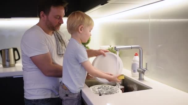 Little Boy Washing Dirty Dishes Child Cleans Crockery While Doing — Stock Video