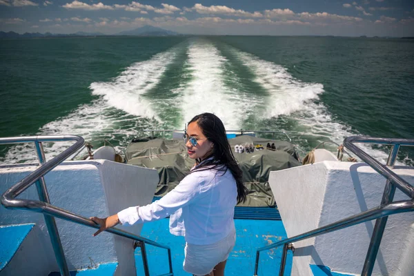 Asian girl in a speed boat — Stock Photo, Image