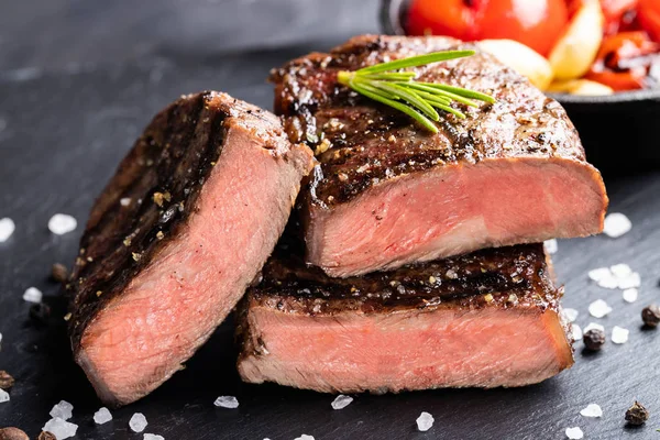 Close-up of steak Top Blade roasting medium ready to eat on dark stone background — Stock Photo, Image