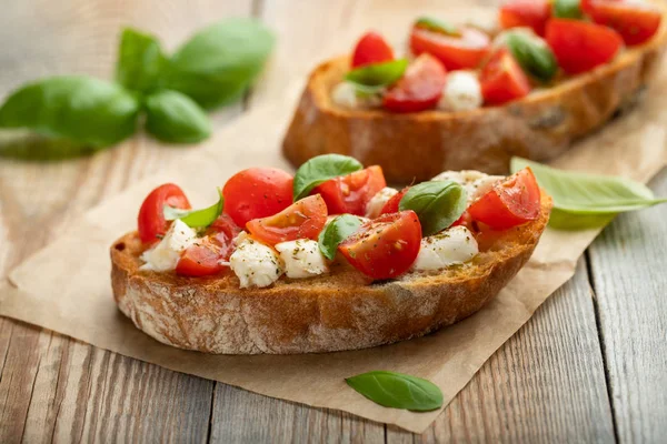 Bruschetta Tomatoes Mozzarella Cheese Basil Old Rustic Table Traditional Italian — Stock Photo, Image