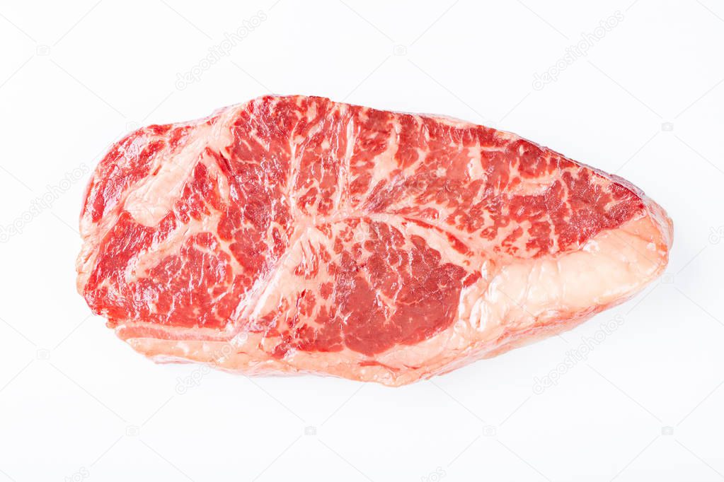 Raw striploin beef steak isolated against white. top view.