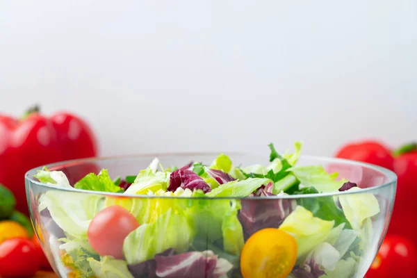 Full Bowl Fresh Green Salad Close Light Table White Background Stock Image