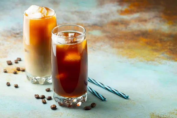 Ice coffee in a tall glass with cream — Stock Photo, Image