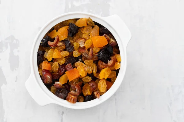 dry fruits for cake in white bowl