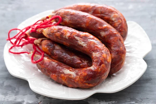 Typical portuguese smoked sausages on beautiful white dish — Stock Photo, Image