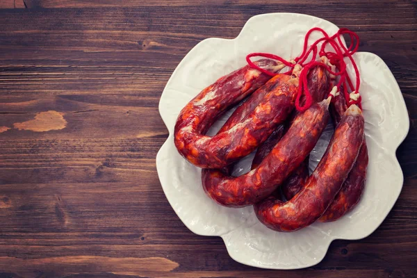 Typical portuguese smoked sausages on beautiful white dish — Stock Photo, Image