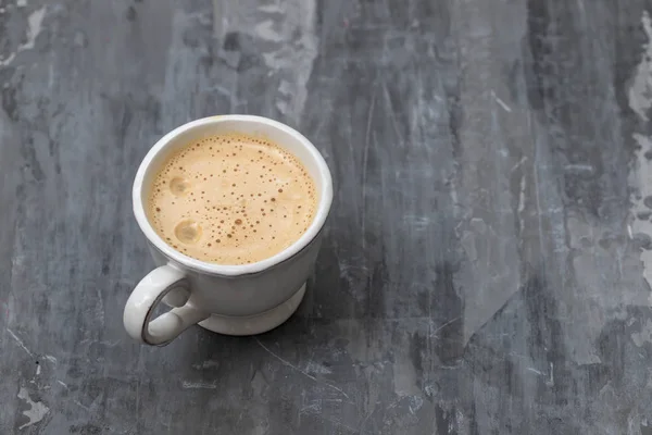 A cup of coffee on ceramic background — Stock Photo, Image