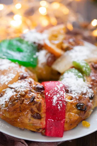 Typical portuguese fruit cake Bolo rei on wooden background — Stock Photo, Image