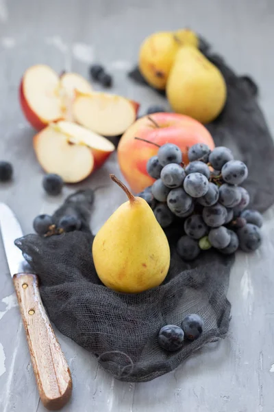 Fruits on gray ceramic background — Stock Photo, Image