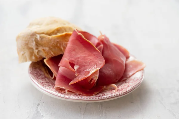 smoked meat prosciutto on small dish