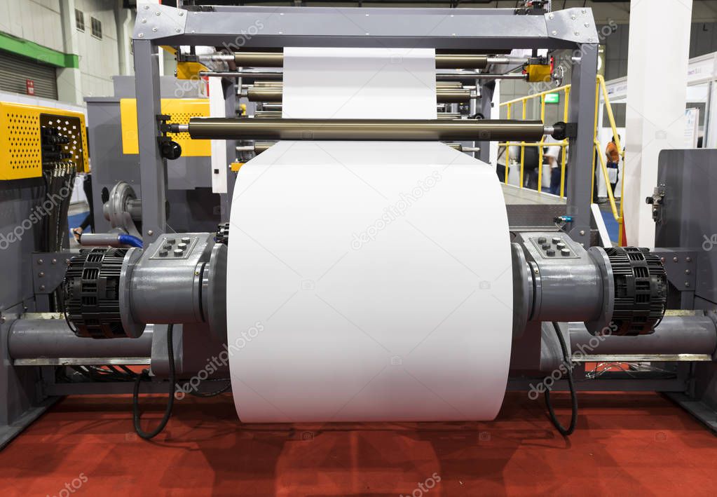roll of white paper in modern paper cutting machine