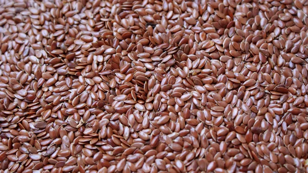 natural flax seeds scattered on the surface