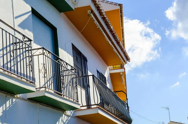 Stylish balcony with a metal railing, solid architectural element, a place of rest and relaxation, vintage decor, balcony