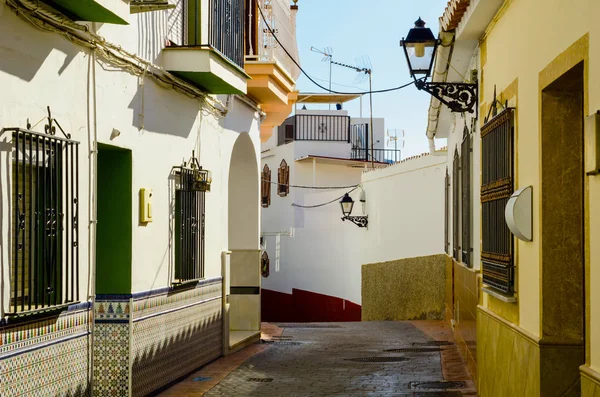 beautiful, picturesque street, narrow road, white facades of buildings, Spanish architecture, sunny day