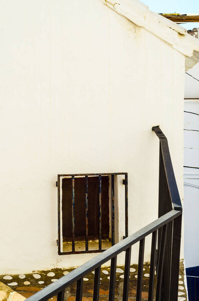 Stylish balcony with a metal railing, solid architectural element, a place of rest and relaxation, vintage decor, balcony