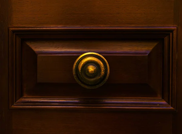 close up on a round door handle with decorative elements, door decoration, vintage