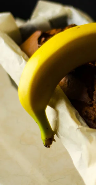 Freshly baked banana cake with nuts, banana bread in baking form, homemade baking