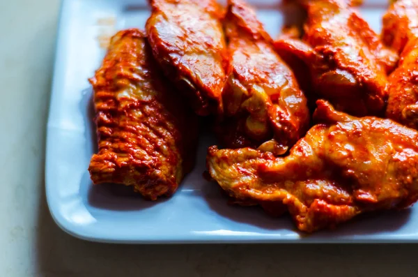 chicken wings marinated in a barbecue sauce, a typical American snack, delicious food