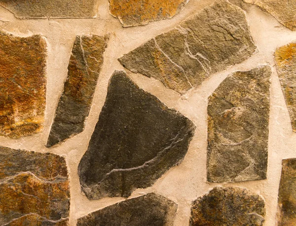 Старый Камень Помещен Стену Интересный Оригинальный Фон Сплошная Стена — стоковое фото