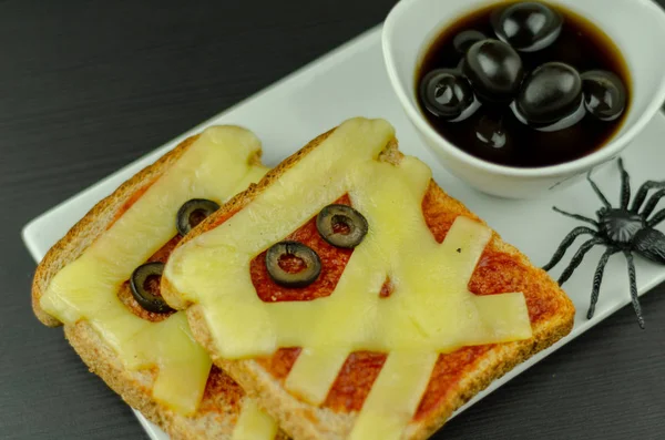 funny sandwiches with mummy for a halloween party, creative serving of food, scary