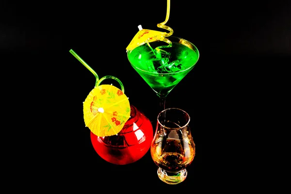 Tasty and colorful drinks based on various alcohols, syrups and liqueurs, the unique effect of the bartender\'s work, party night