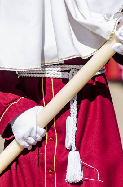 VELEZ-MALAGA, SPAIN - MARCH 27, 2018 People participating in the procession  in the Holy Week in a Spanish city, easter
