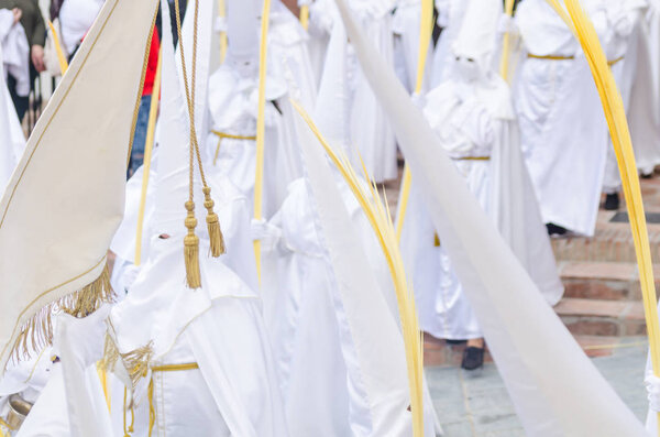 VELEZ-MALAGA, SPAIN - MARCH 25, 2018 People participating in the procession  in the Holy Week in a Spanish city, easter
