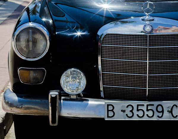 TORRE DEL MAR, SPAIN - JUNE 3, 2018 Old antique cars issued for tourists visiting a seaside town in Spain