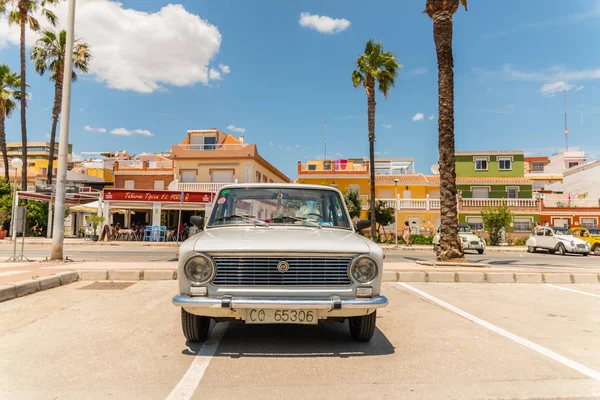 TORRE DEL MAR, SPAIN - JUNE 3, 2018 Old antique cars issued for tourists visiting a seaside town in Spain