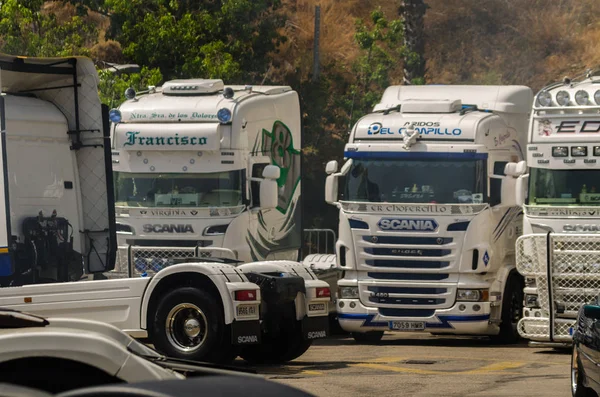 TORROX, SPAIN - JULY 22, 2018 show of tractor units for visitors, powerful machines gathered in a square in an Andalusian town