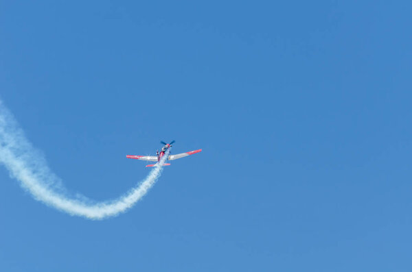 TORRE DEL MAR, SPAIN - JULY 29, 2018 planes flying over the beach in a seaside town, aerobatics airshow in Andalusia