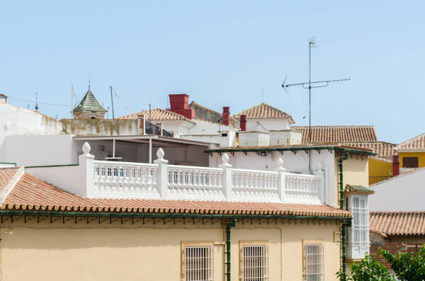 VELEZ-MALAGA, SPAIN - AUGUST 17, 2018 roofs and facades of buildings in a Spanish city, characteristic architecture in the south of Spain